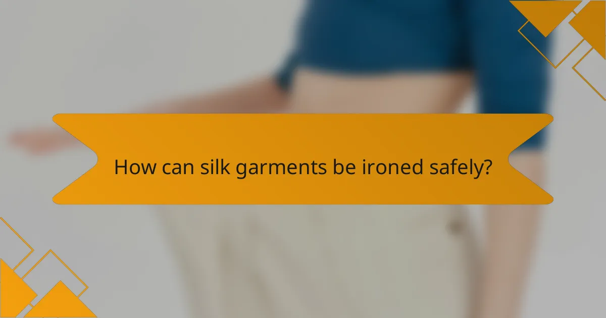 How can silk garments be ironed safely?